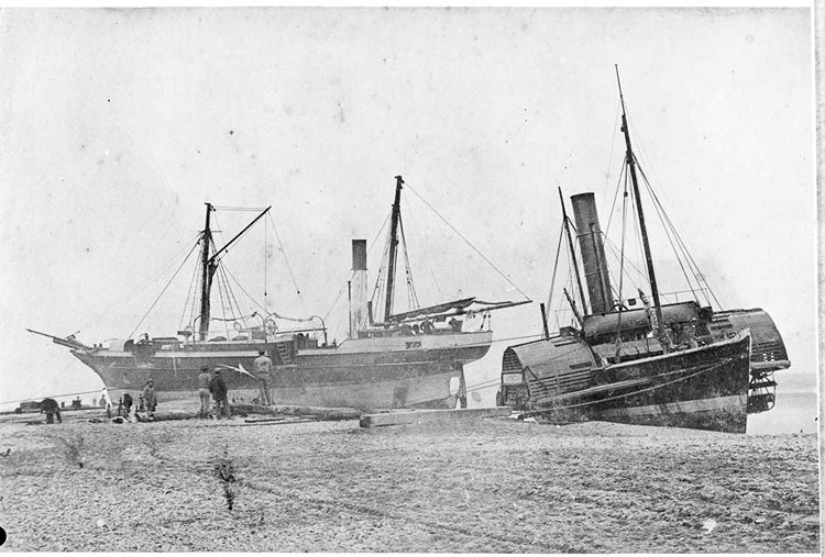 This photograph shows the screw steamer William Miskin and the paddle-steamer tug Lioness aground at Hokitika in 1866. Both vessels were later wrecked. (Photo courtesy nzhistory.govt.nz)