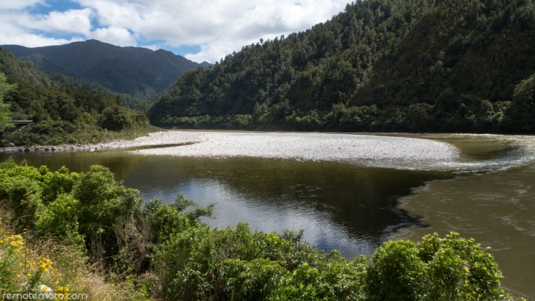 The tannin coloured Ohikanui River meeting the chocolate coloured Buller River